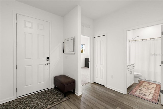 entrance foyer with dark hardwood / wood-style floors