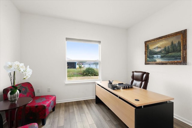 office space with dark wood-type flooring