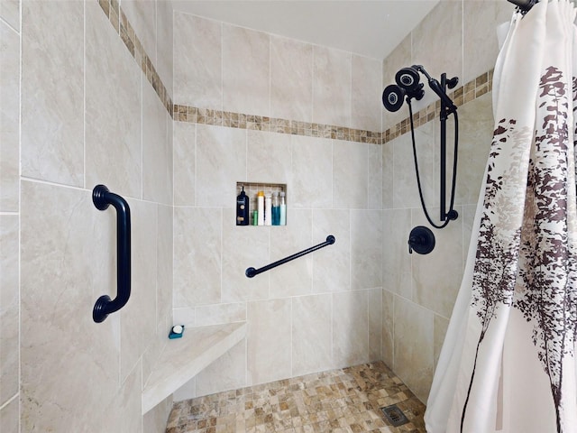 full bathroom with tiled shower