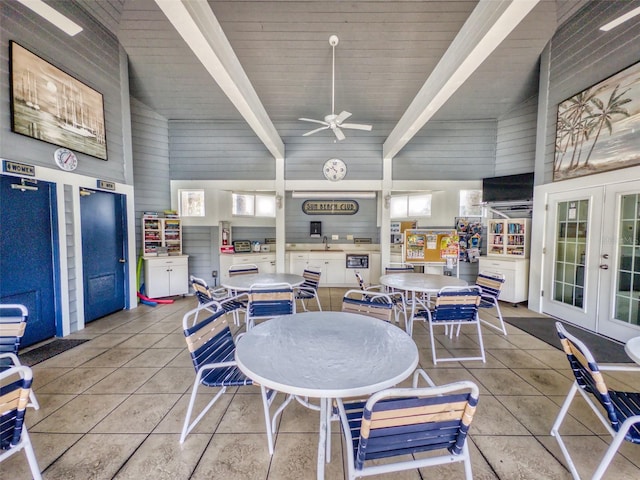 tiled dining room with high vaulted ceiling, french doors, and beamed ceiling