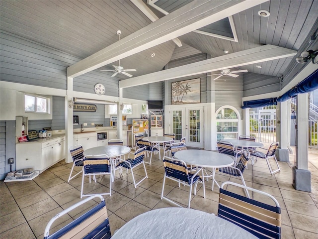 view of patio / terrace featuring outdoor dining area, a ceiling fan, and french doors