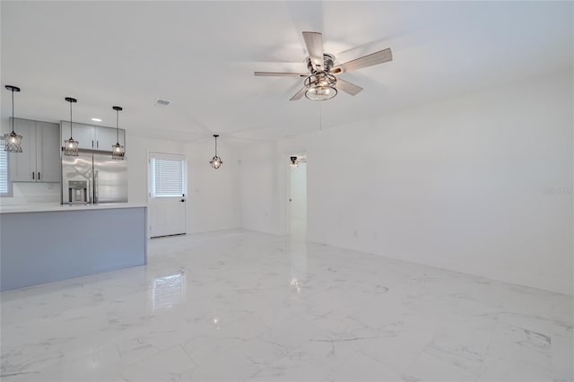 unfurnished living room with ceiling fan