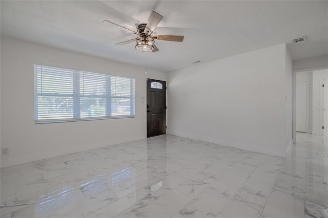 spare room featuring ceiling fan