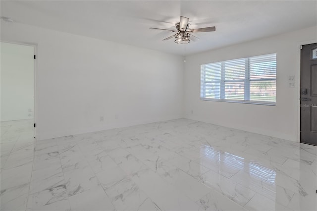 spare room featuring ceiling fan