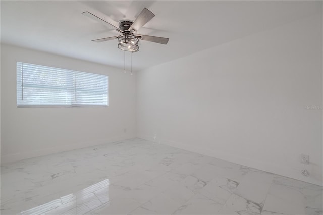 spare room featuring ceiling fan