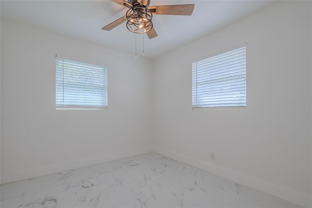 spare room with ceiling fan