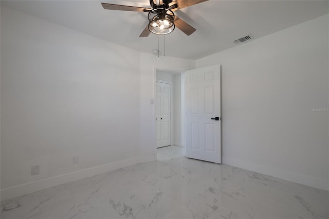 empty room featuring ceiling fan