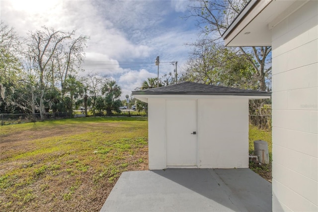 view of outdoor structure featuring a lawn