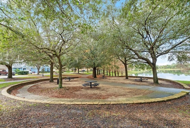 surrounding community featuring a water view