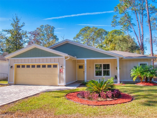 ranch-style house with a front yard and a garage