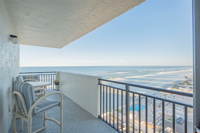 balcony featuring a water view