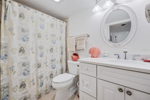 bathroom with tile patterned floors, vanity, toilet, and a shower with curtain