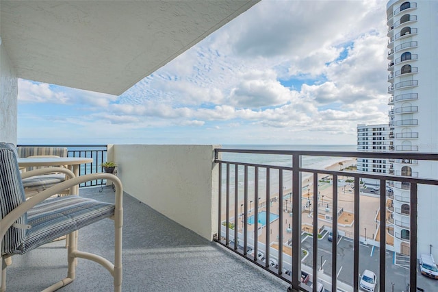 balcony featuring a water view