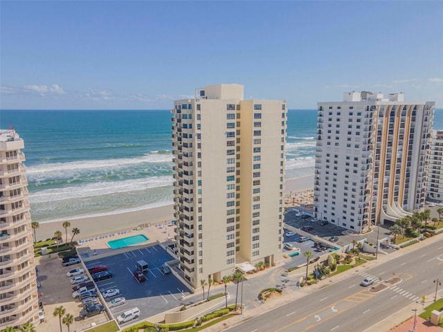 birds eye view of property featuring a water view and a view of the beach