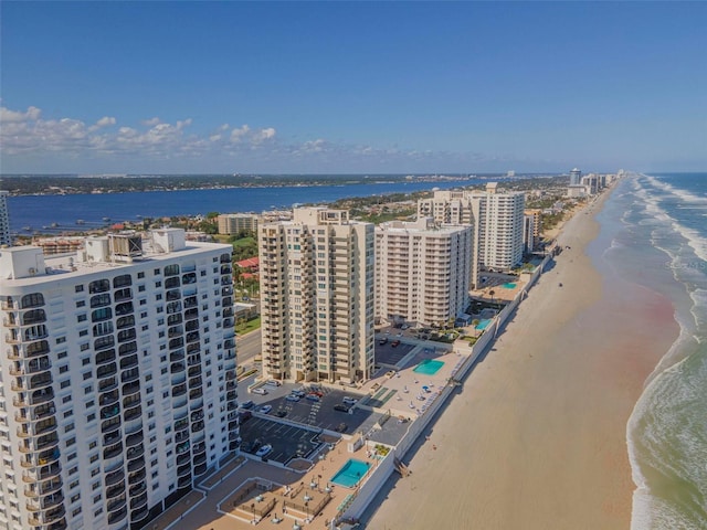 bird's eye view featuring a beach view and a water view