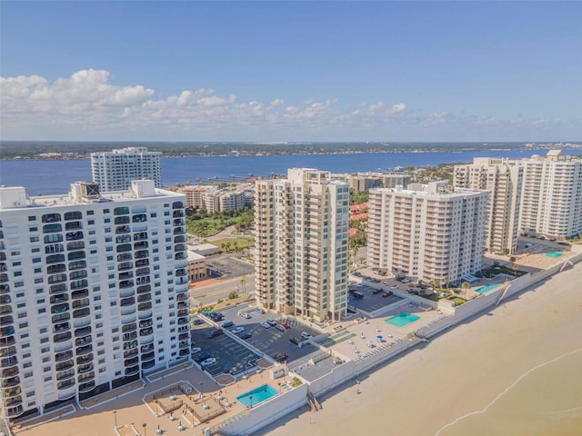 aerial view featuring a water view and a view of the beach