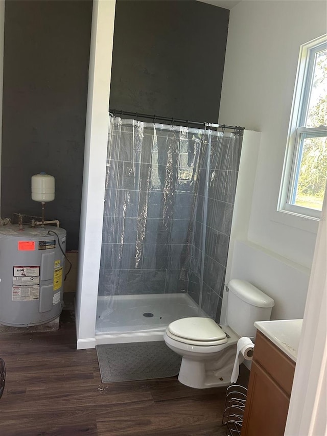 bathroom with vanity, curtained shower, electric water heater, and hardwood / wood-style floors