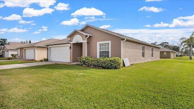 single story home with a garage and a front lawn