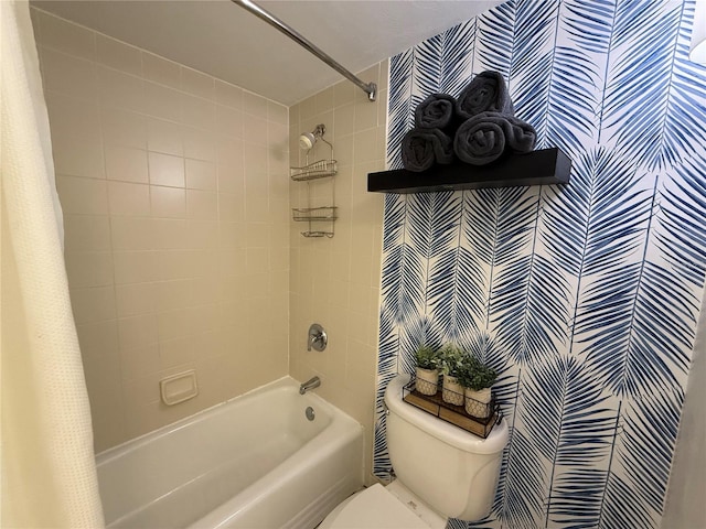 bathroom featuring shower / bathtub combination with curtain and toilet