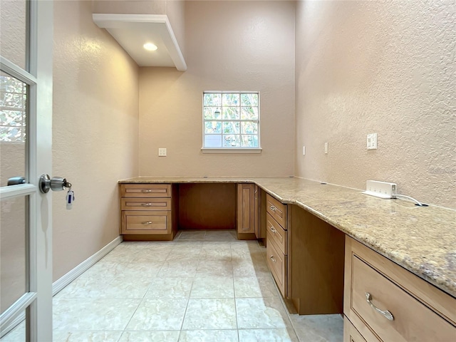 bathroom featuring tile patterned floors and a wealth of natural light