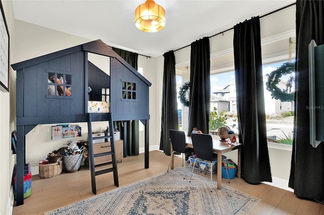 bedroom with wood-type flooring