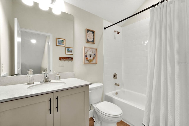 full bathroom with vanity, toilet, and shower / bath combo with shower curtain