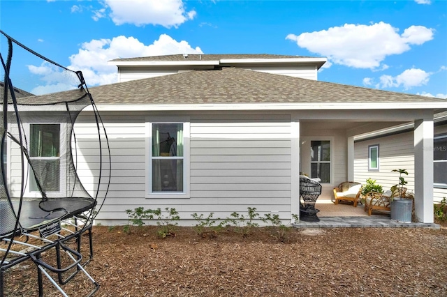 rear view of house with a patio