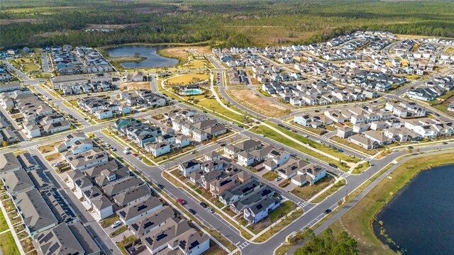 birds eye view of property featuring a water view