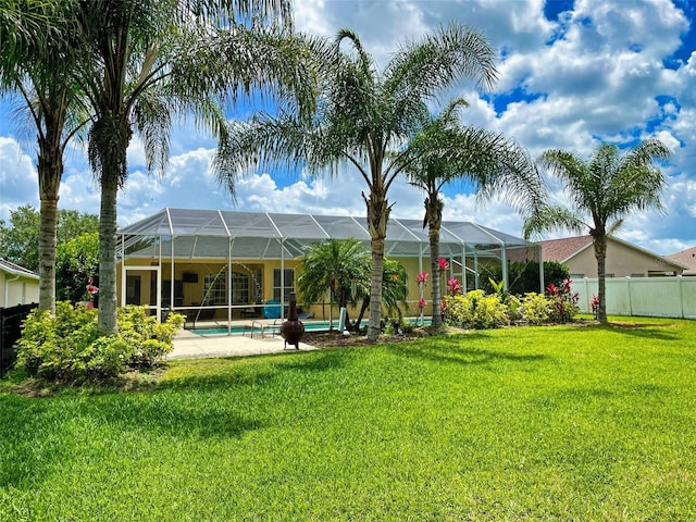 view of yard featuring a lanai and a fenced in pool