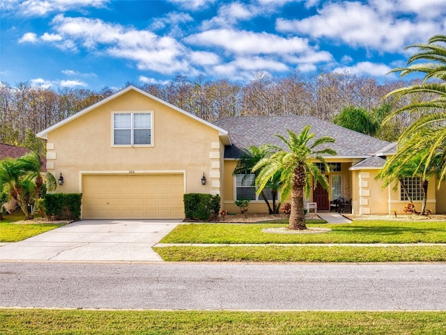 view of front facade with a front lawn and a garage