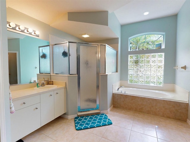 bathroom with lofted ceiling, tile patterned floors, and plus walk in shower