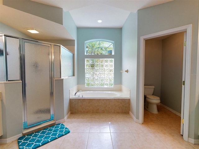 bathroom with toilet, tile patterned floors, and plus walk in shower