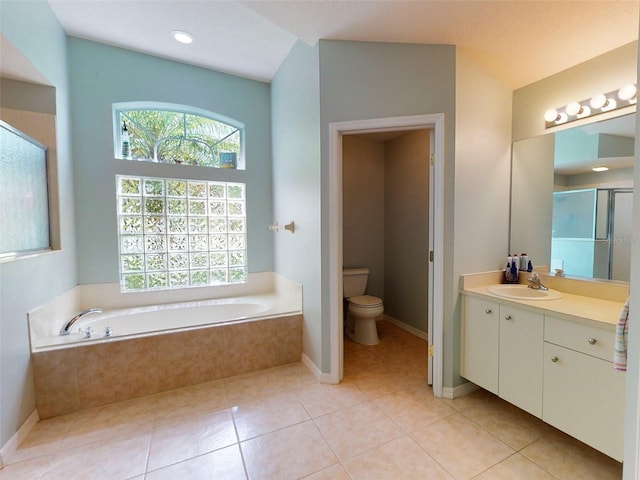 full bathroom featuring toilet, shower with separate bathtub, tile patterned floors, and vanity