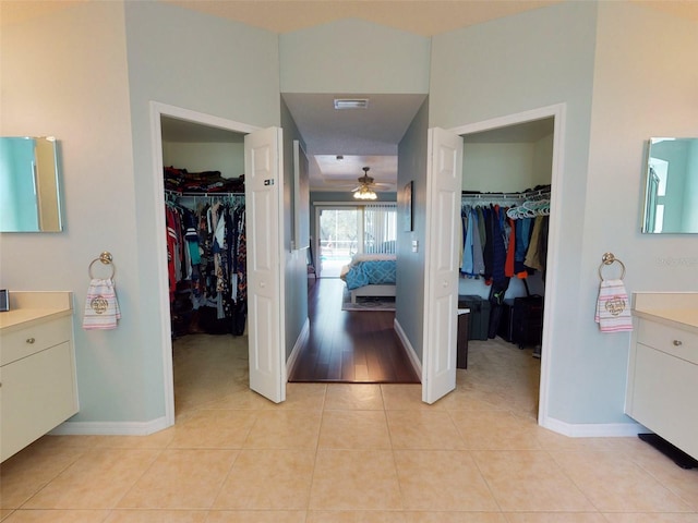 bathroom with ceiling fan, vanity, and tile patterned floors