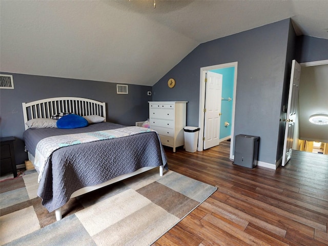 bedroom featuring lofted ceiling and wood-type flooring