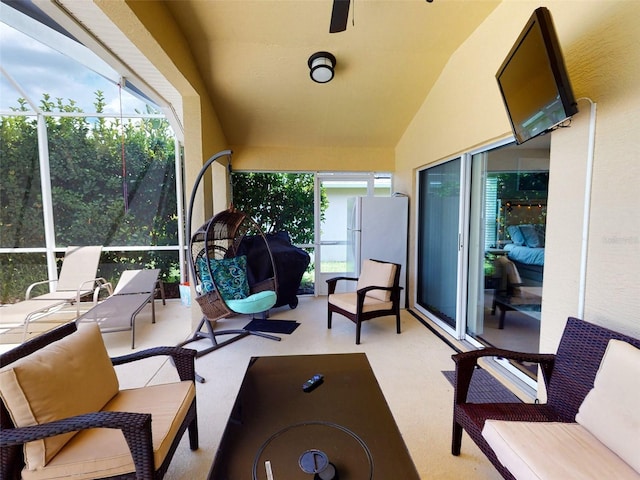 sunroom featuring vaulted ceiling