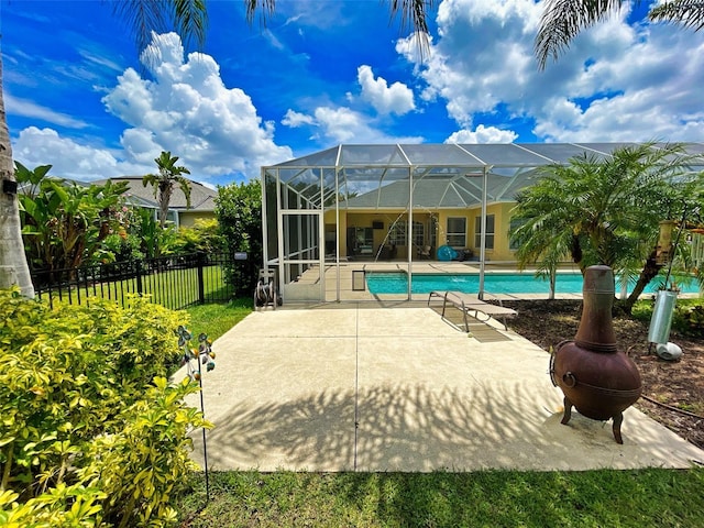 exterior space with a lanai, an outdoor fire pit, and a patio