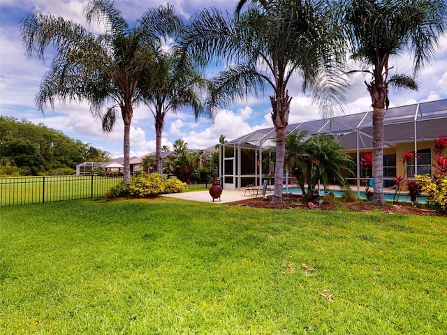 view of yard featuring a lanai and a patio area