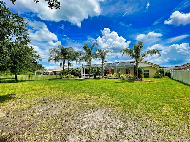 view of yard featuring a lanai