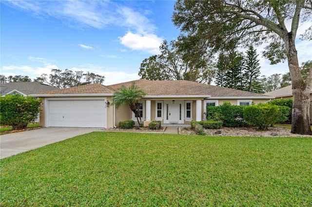 single story home featuring a garage and a front lawn