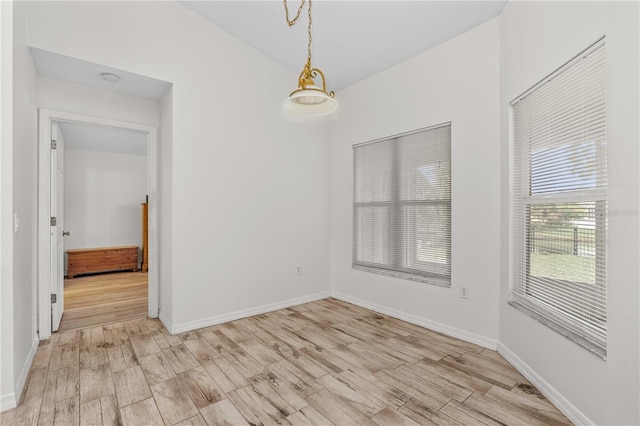 spare room with light wood-type flooring