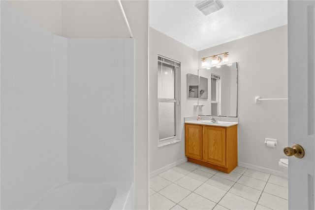 full bathroom with tile patterned flooring, a textured ceiling, toilet, shower / washtub combination, and vanity