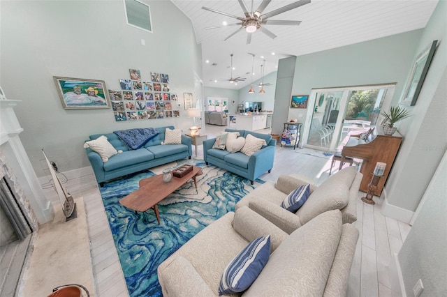 living room with ceiling fan, light hardwood / wood-style flooring, high vaulted ceiling, and wooden ceiling