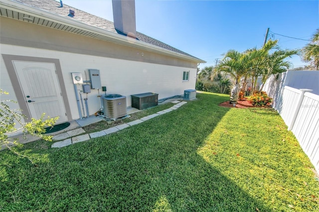 view of yard with central AC