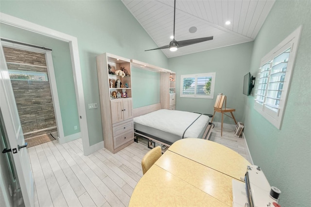 bedroom with ceiling fan, light wood-type flooring, wood ceiling, and vaulted ceiling