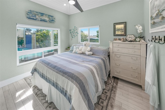 bedroom with light hardwood / wood-style flooring, ceiling fan, and wood ceiling