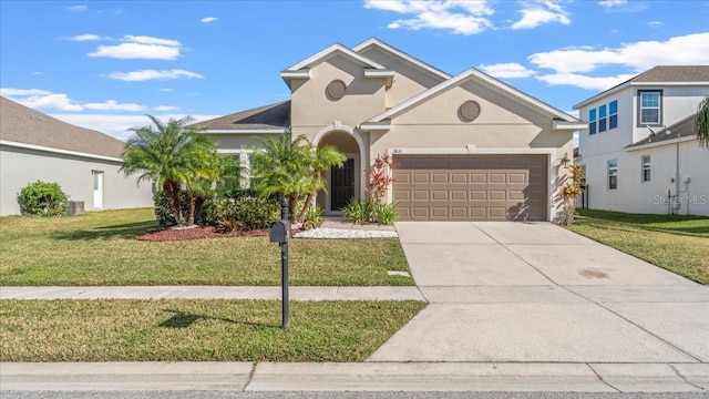 view of front of property with a garage and a front lawn