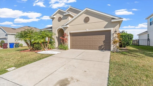 view of front of property with a garage and a front lawn