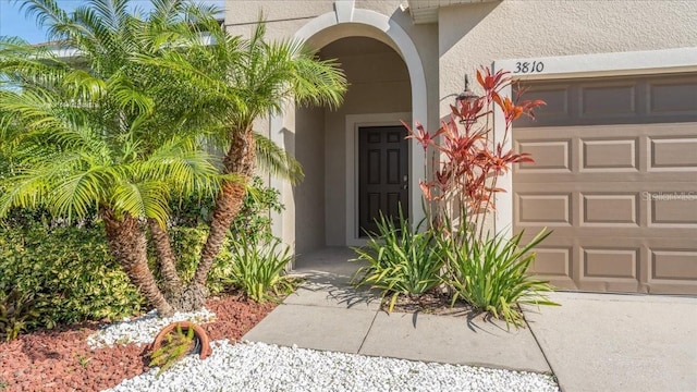 doorway to property featuring a garage