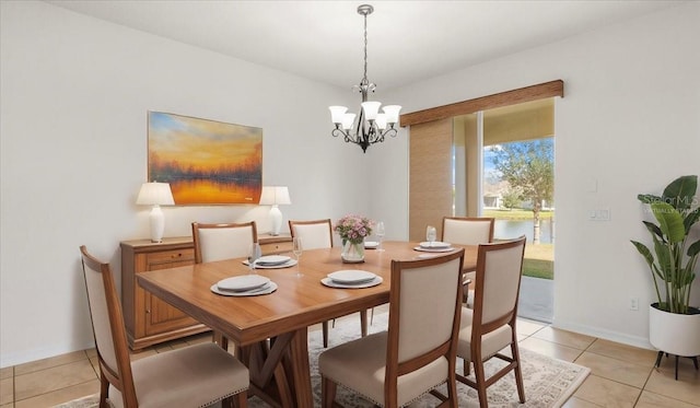 tiled dining area featuring a notable chandelier